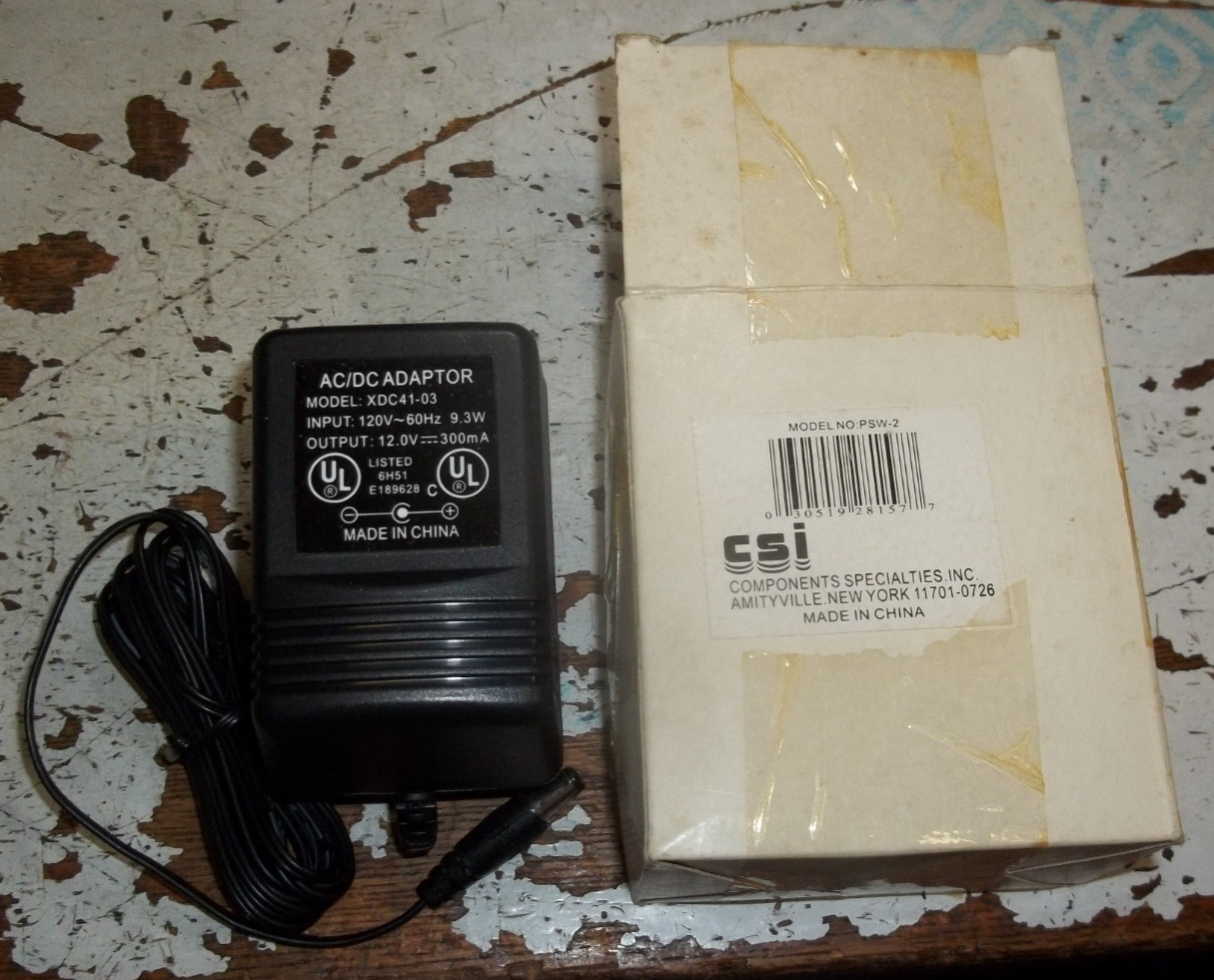CSI PSW-2 AC/DC ADAPTOR XDC41-03 120V~60HZ 12.0V 300MA (163-3)